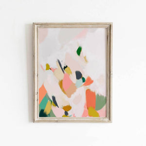 Colourful abstract wall print with bold brushstrokes in coral, olive, and navy displayed in a light wooden frame.