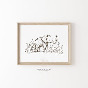 Hand-drawn elephant nursery print with wildflowers, styled in a natural wood frame for neutral safari-themed kids’ wall decor.