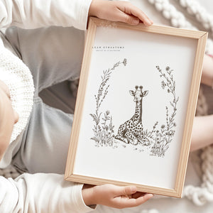 Child holding hand-drawn giraffe safari print, perfect for South African-inspired nursery decor or nature-themed kids’ spaces.