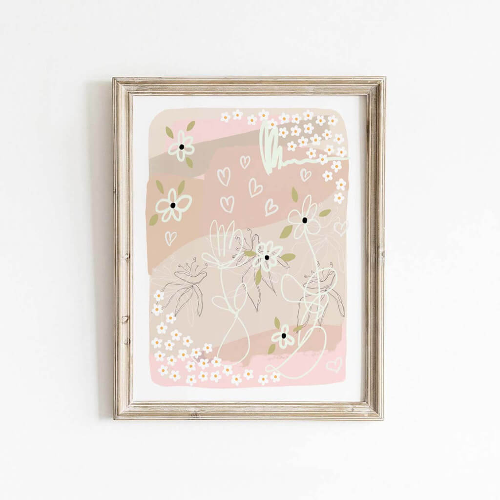 Soft blush pink abstract floral print with whimsical hearts, framed and styled against a white wall.