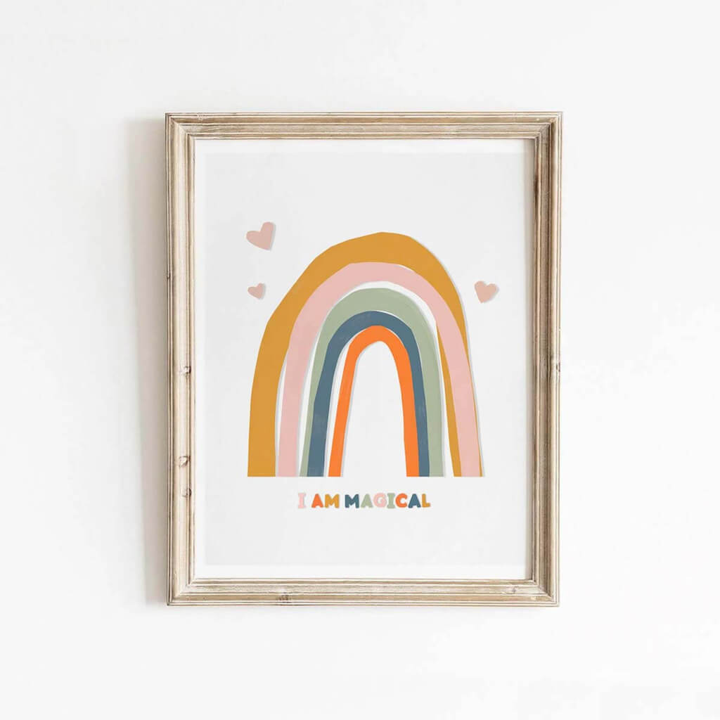 A sweet colourful abstract rainbow print that says I am Magical underneath the rainbow.