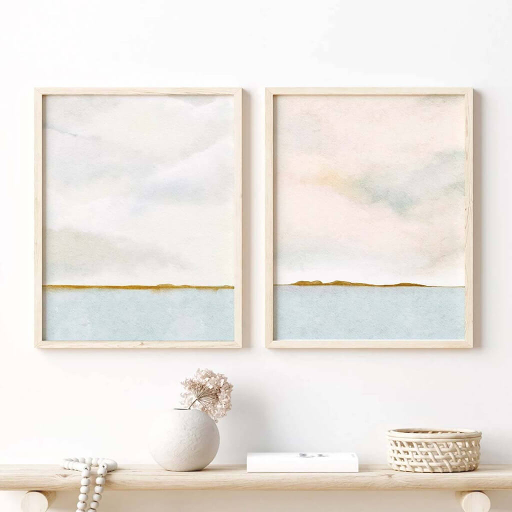 Pretty landscape watercolours featuring a calm lake, and billowy cloudy skies by artist Leah Straatsma