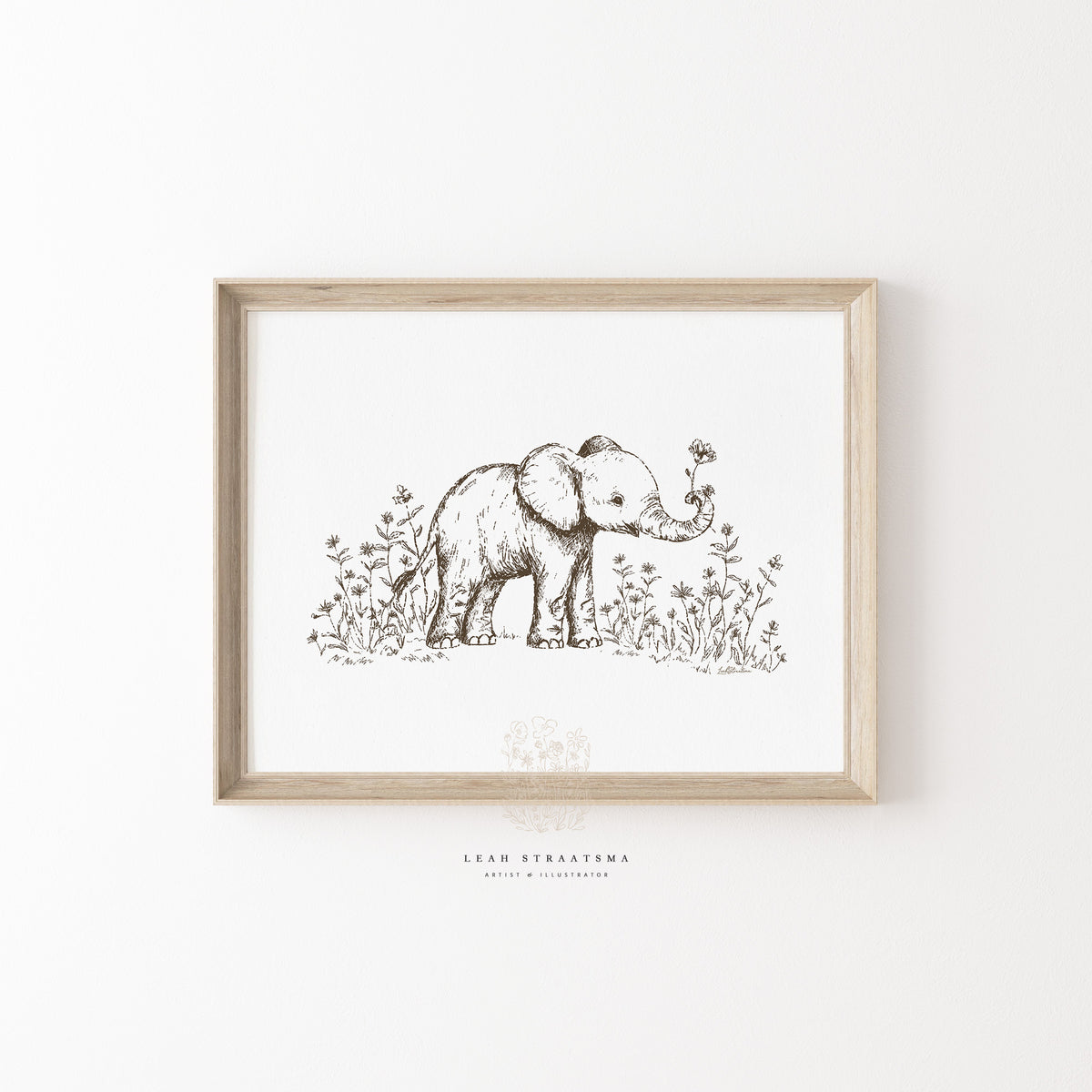 Hand-drawn elephant nursery print with wildflowers, styled in a natural wood frame for neutral safari-themed kids’ wall decor.