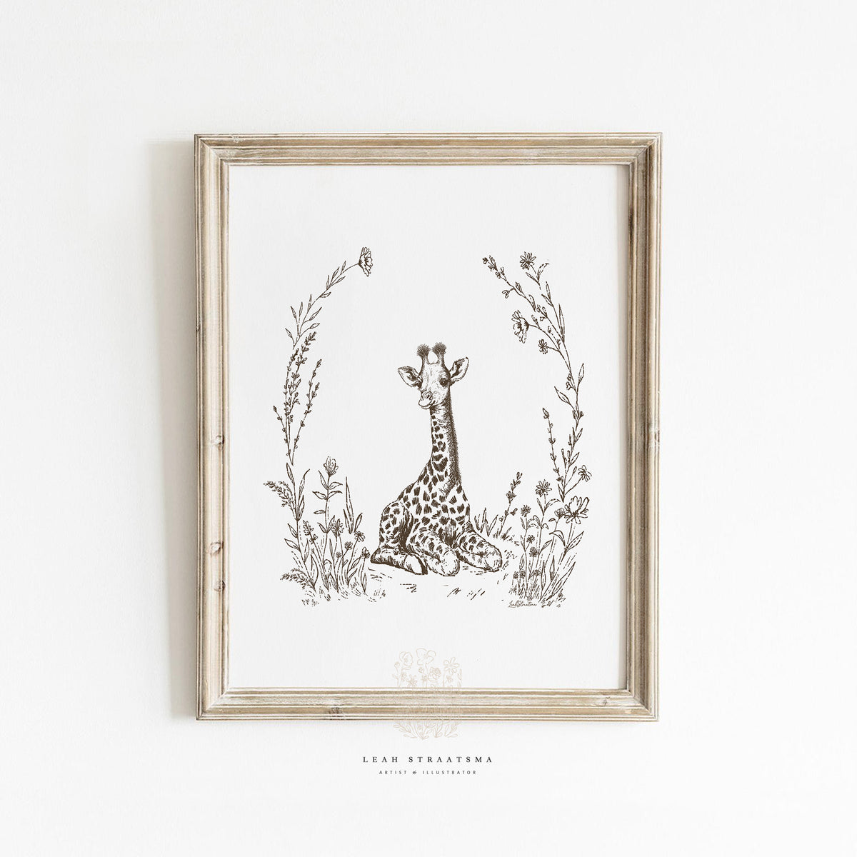 Framed giraffe nursery wall art in sepia tones, styled in a natural, safari-themed kids’ room with neutral and vintage-inspired decor.