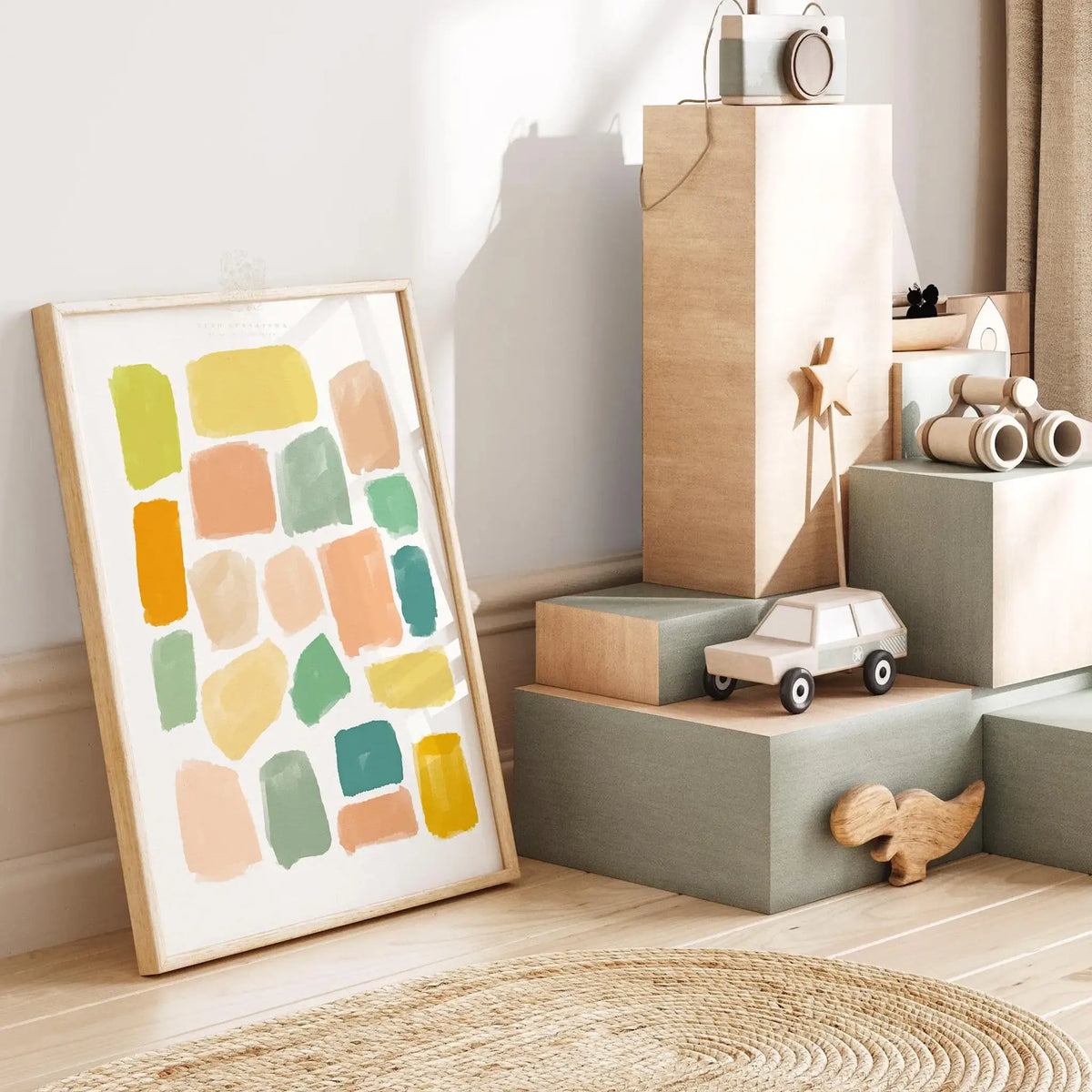 Minimalist neutral abstract wall art print with soft peach and sage tones, styled in a modern, light-filled bedroom.