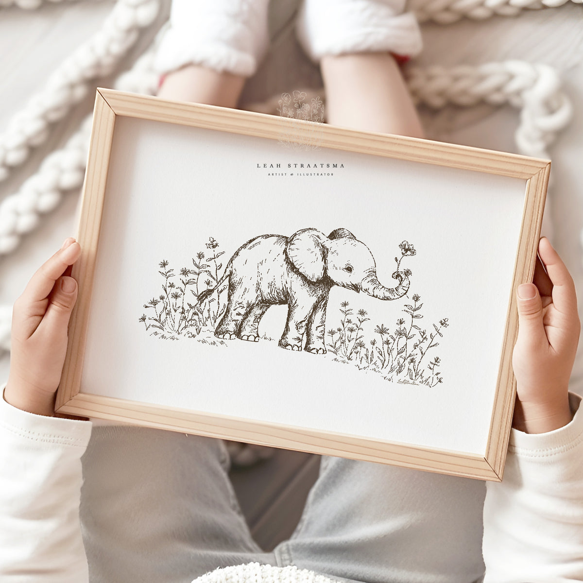 Sepia ink baby elephant wall art held by child, perfect for safari nursery themes, baby animal decor, or nature-inspired kids’ rooms.