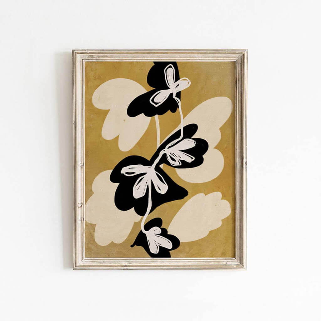 Mid-century style modern abstract floral print from Leah Straatsma in mustard yellow, black, and cream tones.