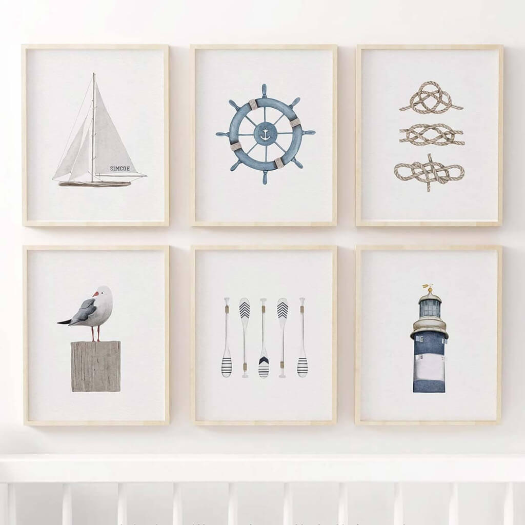 Watercolour Coastal Art print set featuring a seagull, lighthouse, paddles, wheel helm, knots, and a sailboat from artist Leah Straatsma