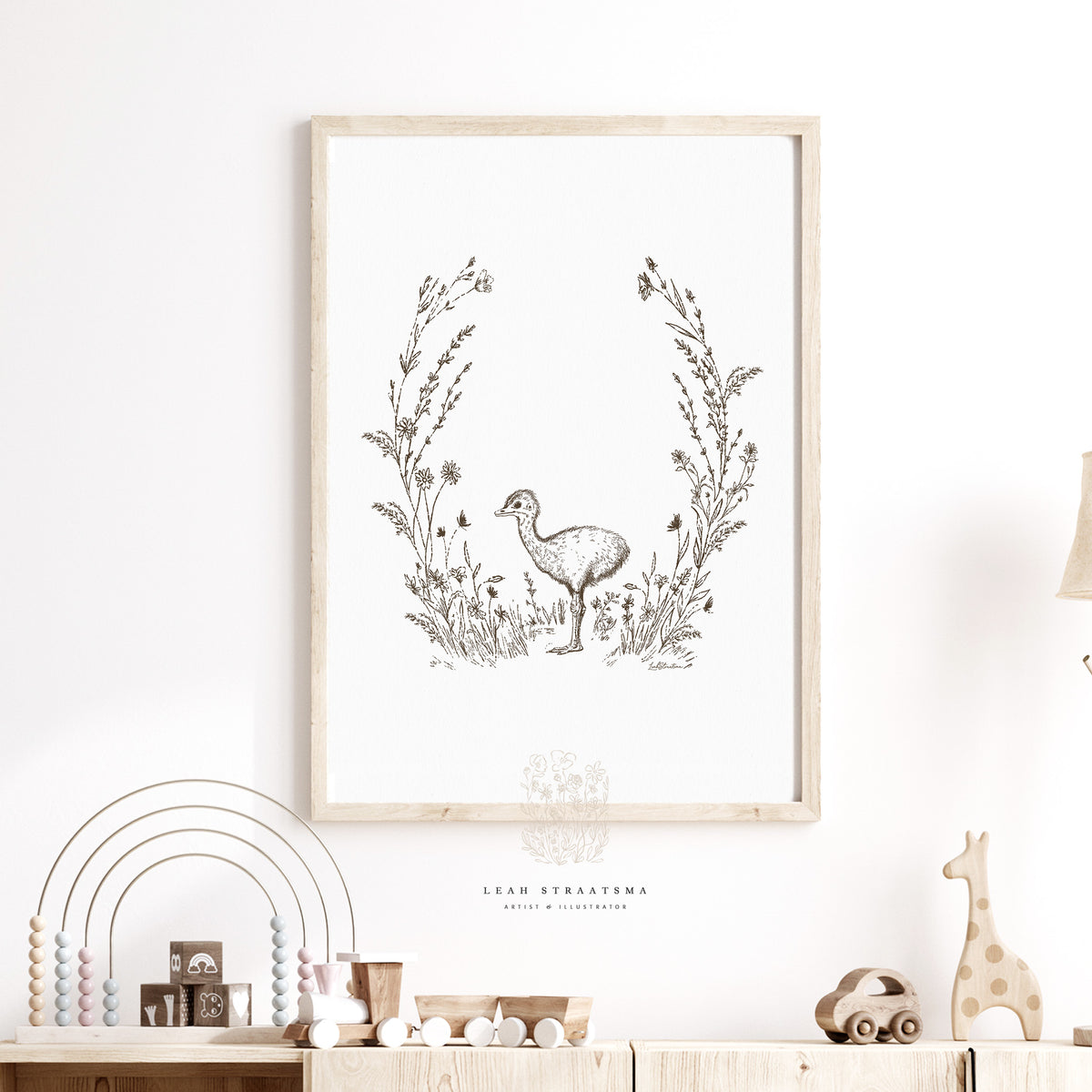 Framed baby ostrich wall art in sepia tones, styled above a nursery dresser with soft neutral decor and safari-inspired room details.