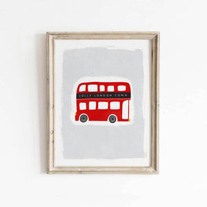 Printable 'Jolly London Town' red double decker bus artwork, shown in a simple light wood frame mockup against a white wall.
