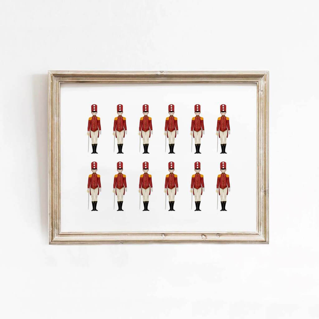 Nutcracker toy soldier art print with red uniform and gold details, perfect for holiday wall decor in living rooms or entryways