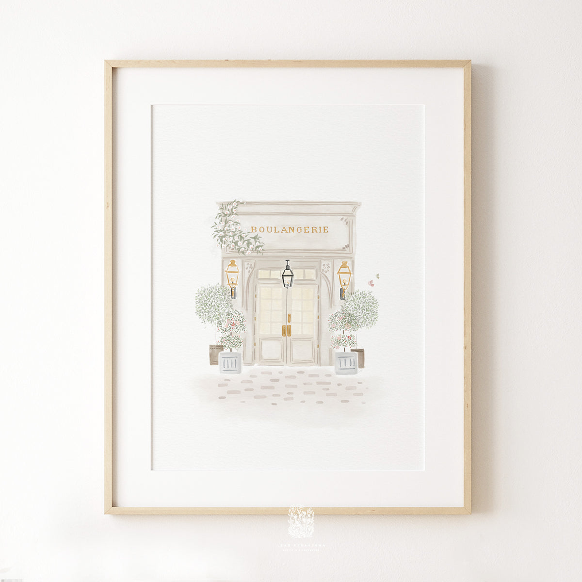 Boulangerie wall art hanging on a white neutral wall, perfect for entryways or transitional spaces.